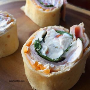 tortilla roll up with cream cheese, ham and cheese