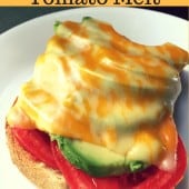 toast with tomato slice avocado slice and melted cheese