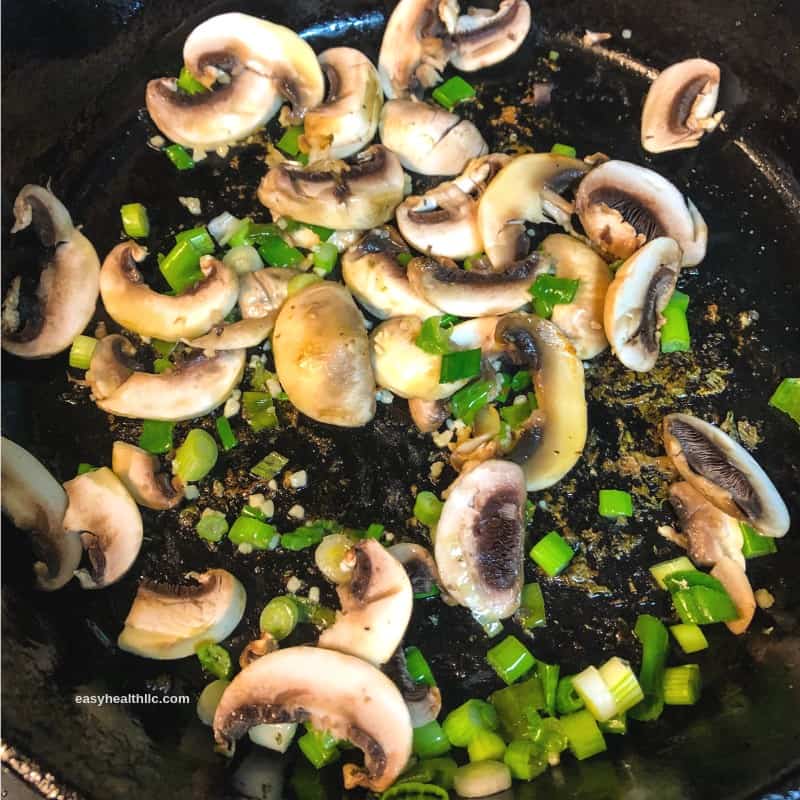 sautéed green onions and mushrooms in skillet