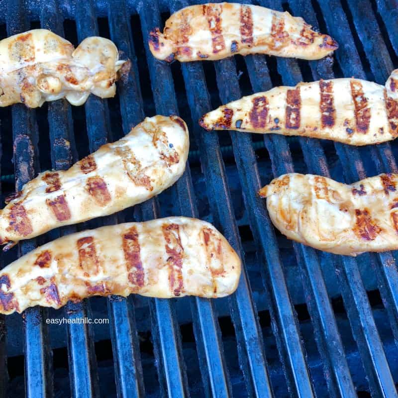 grilled chicken tenders on grill grate