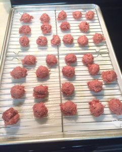 low carb gyro bowl meatballs on rack ready for oven