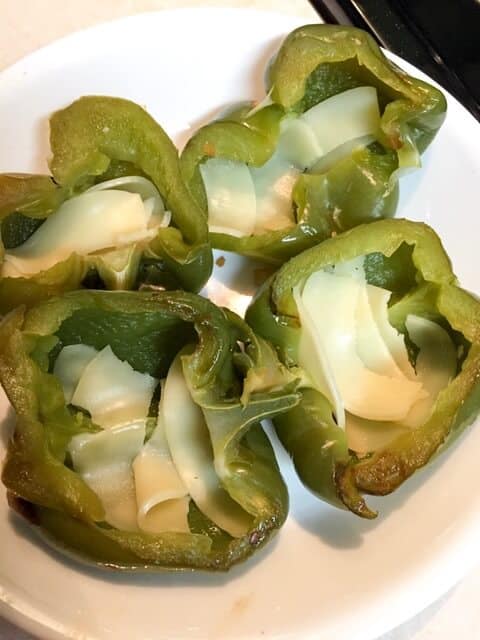 green bell pepper halves with cheese inside