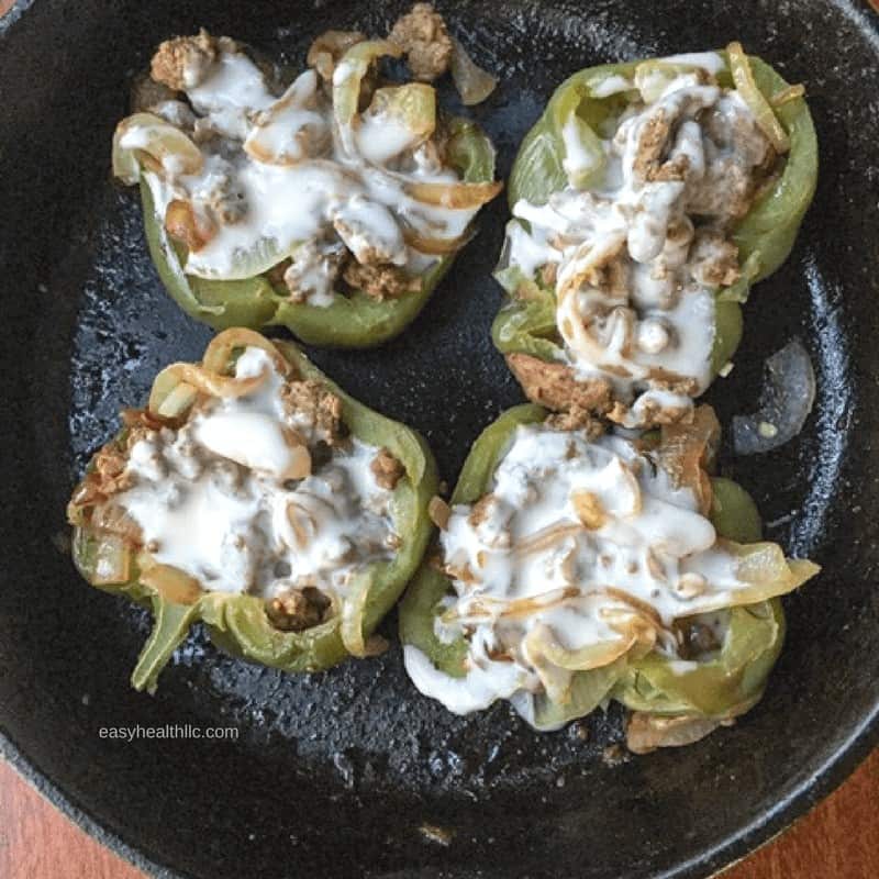 philly cheesesteak stuffed peppers in iron skillet