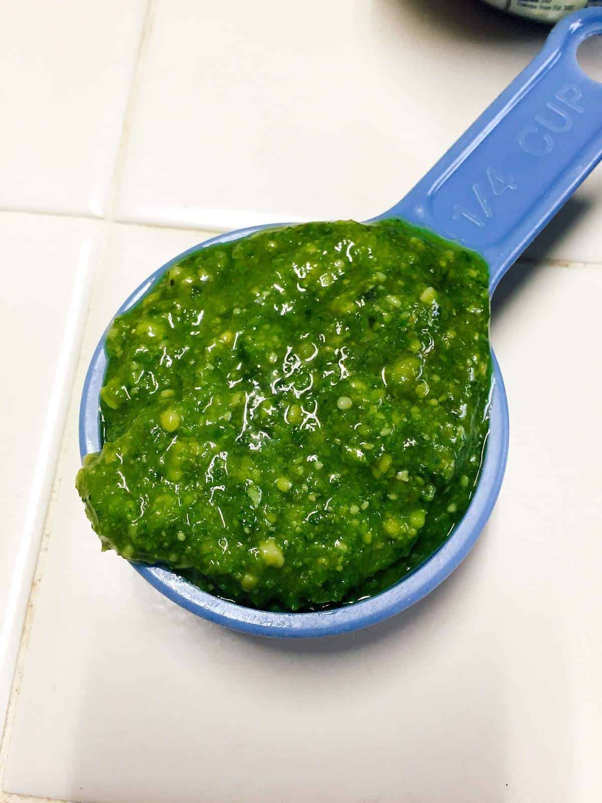 pesto in measuring cup