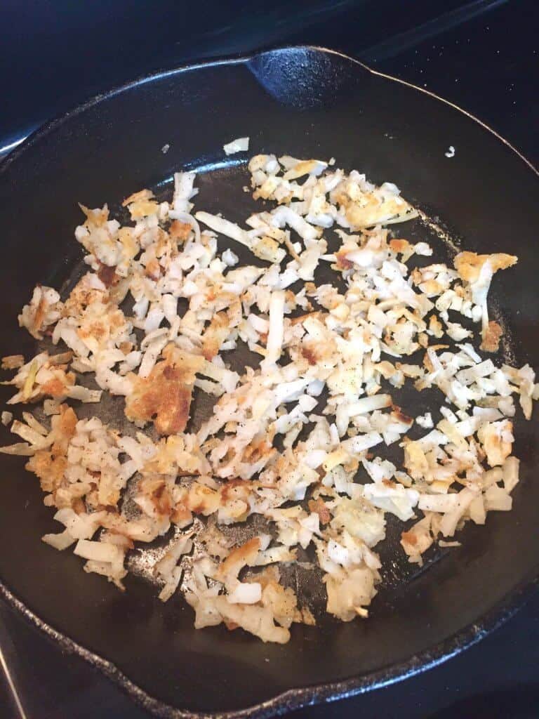 hash browns cooking in skillet