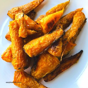 roasted baby carrots in white bowl