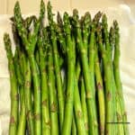 fresh asparagus on parchment paper