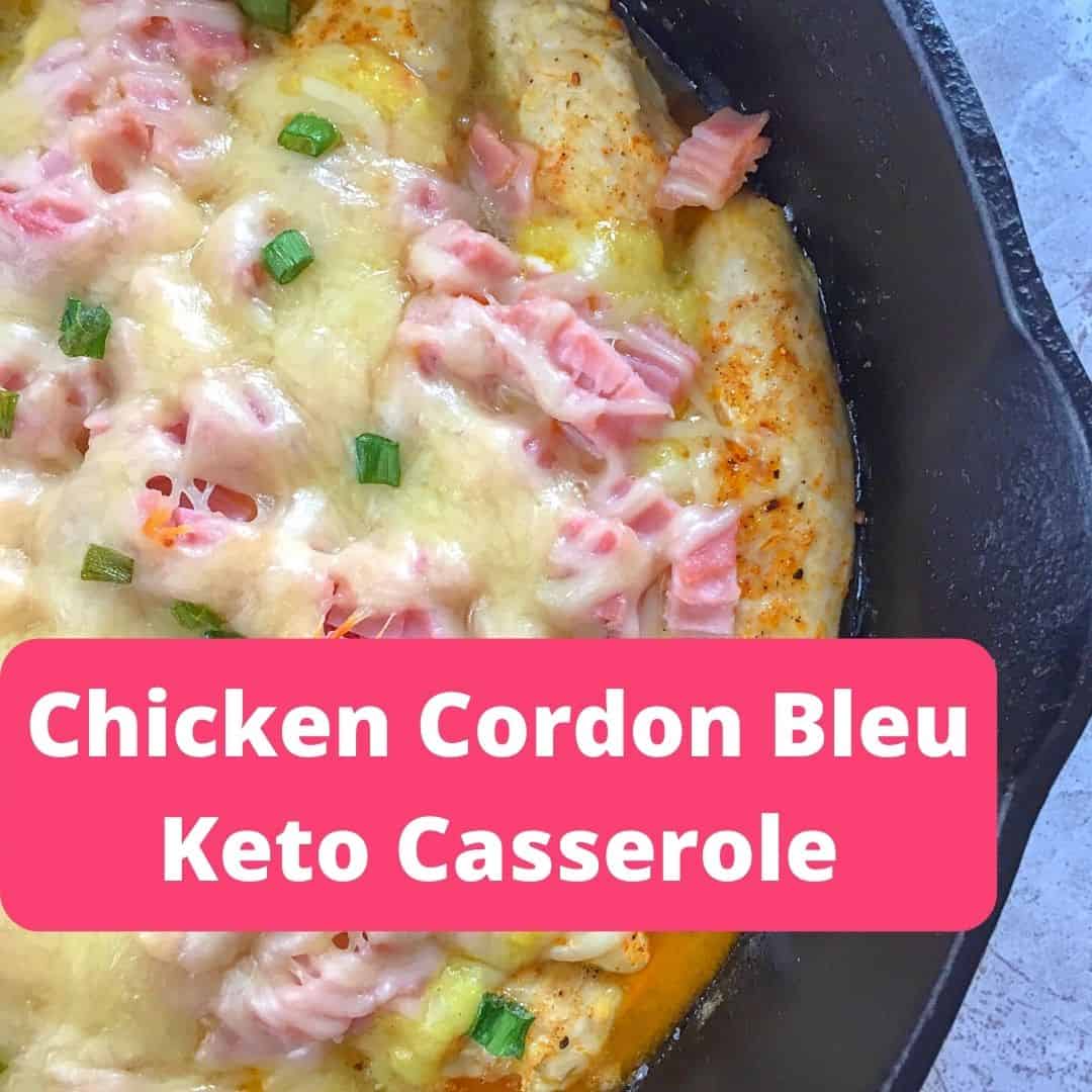 chicken with ham, cheese,sauce in black skillet