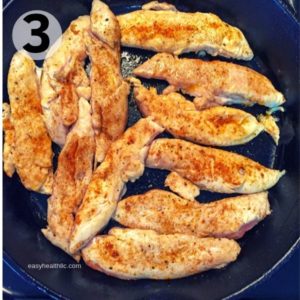 chicken tenders in iron skillet