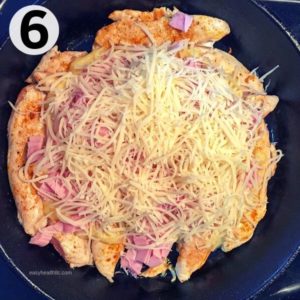chicken ham and cheese in iron skillet