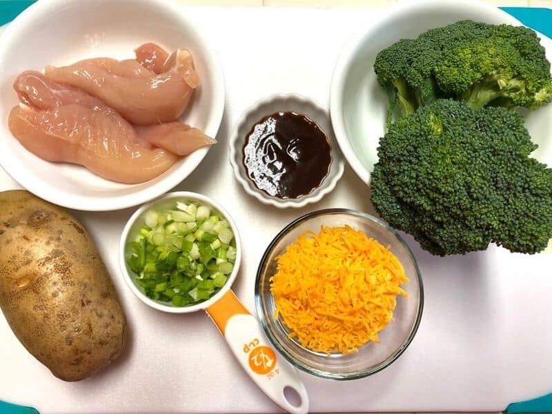 chicken breast, broccoli, cheese, potato on white board
