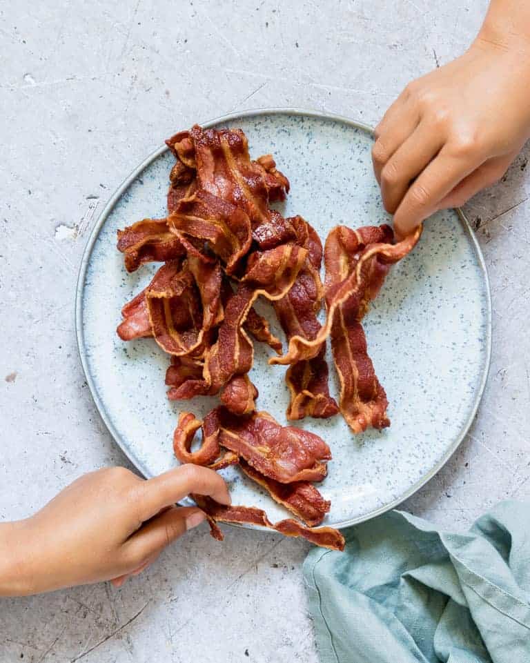 bacon on white plate