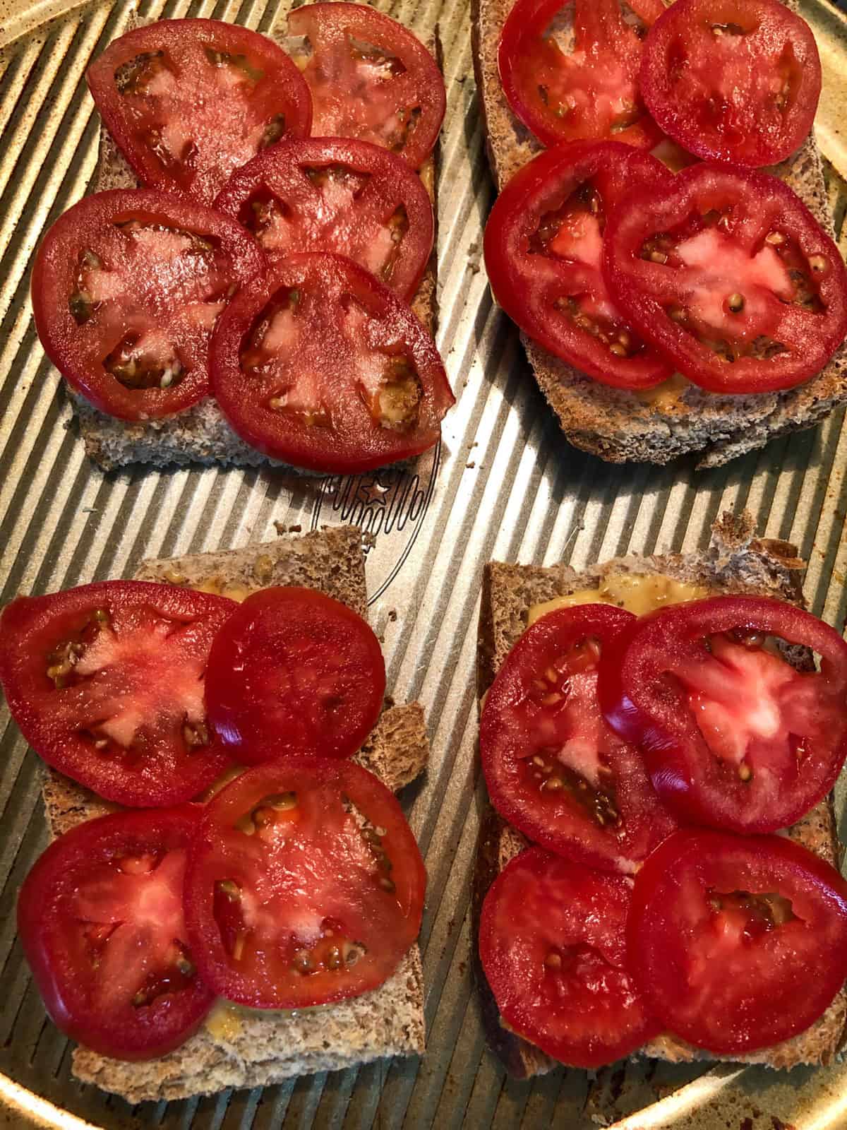 sliced tomatoes on top of toast