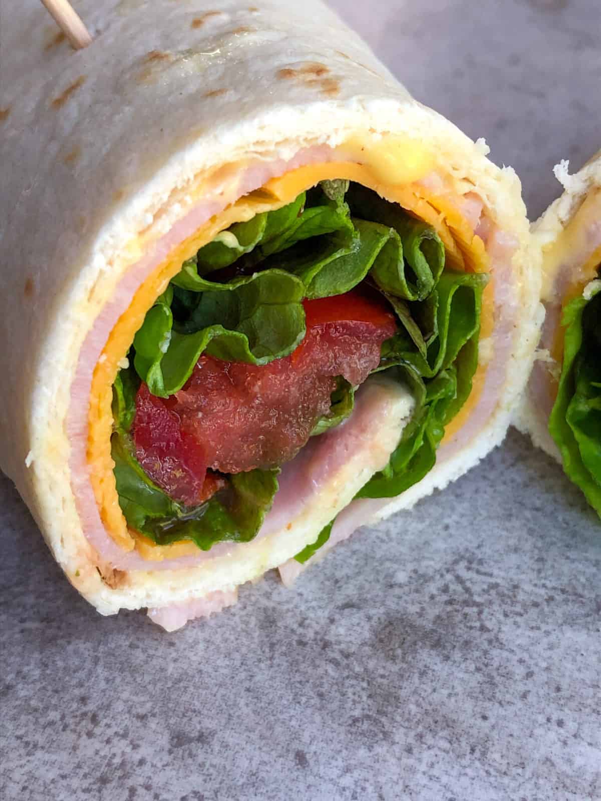 turkey roll up on cutting board