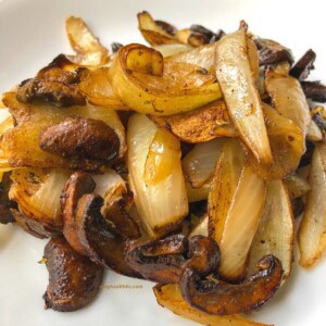 cooked mushrooms and onions on white plate