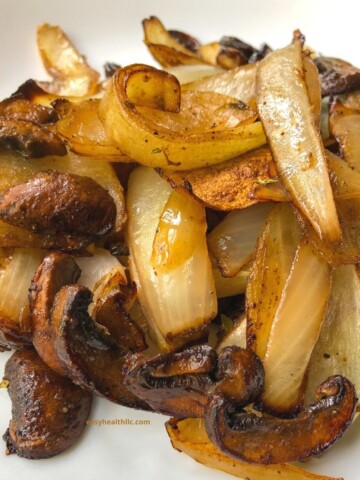 cooked mushrooms and onions on white plate