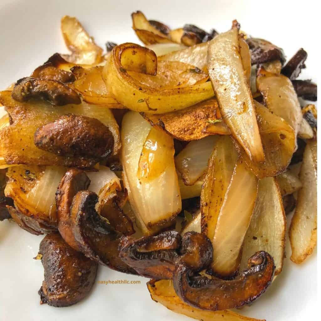 roasted mushrooms and onions on white plate