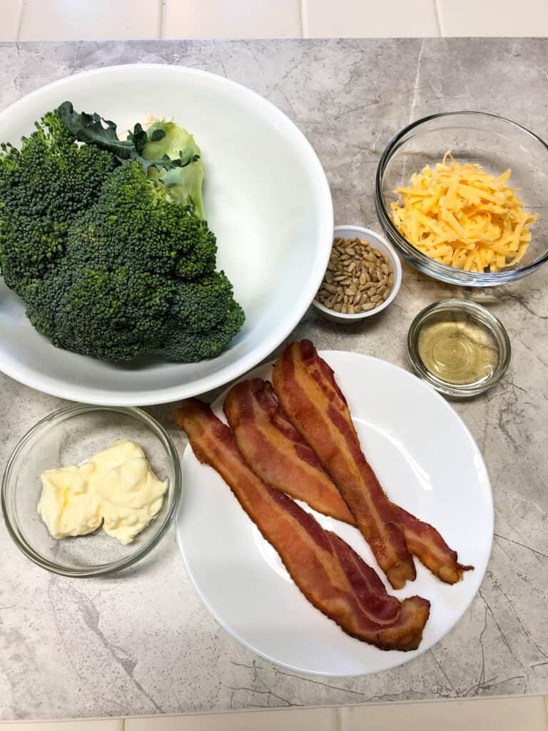 broccoli crown, bacon, cheese, mayo in clear bowls 