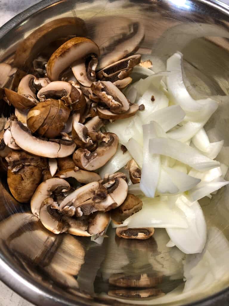 chopped onions and mushrooms in bowl
