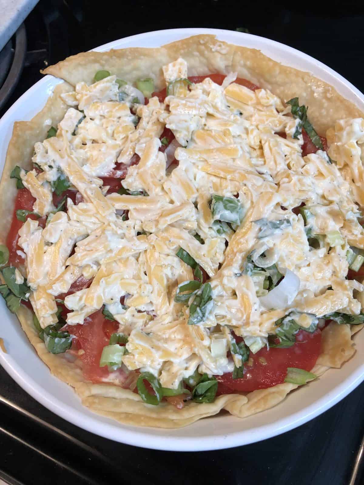 cheese mixture over tomato pie