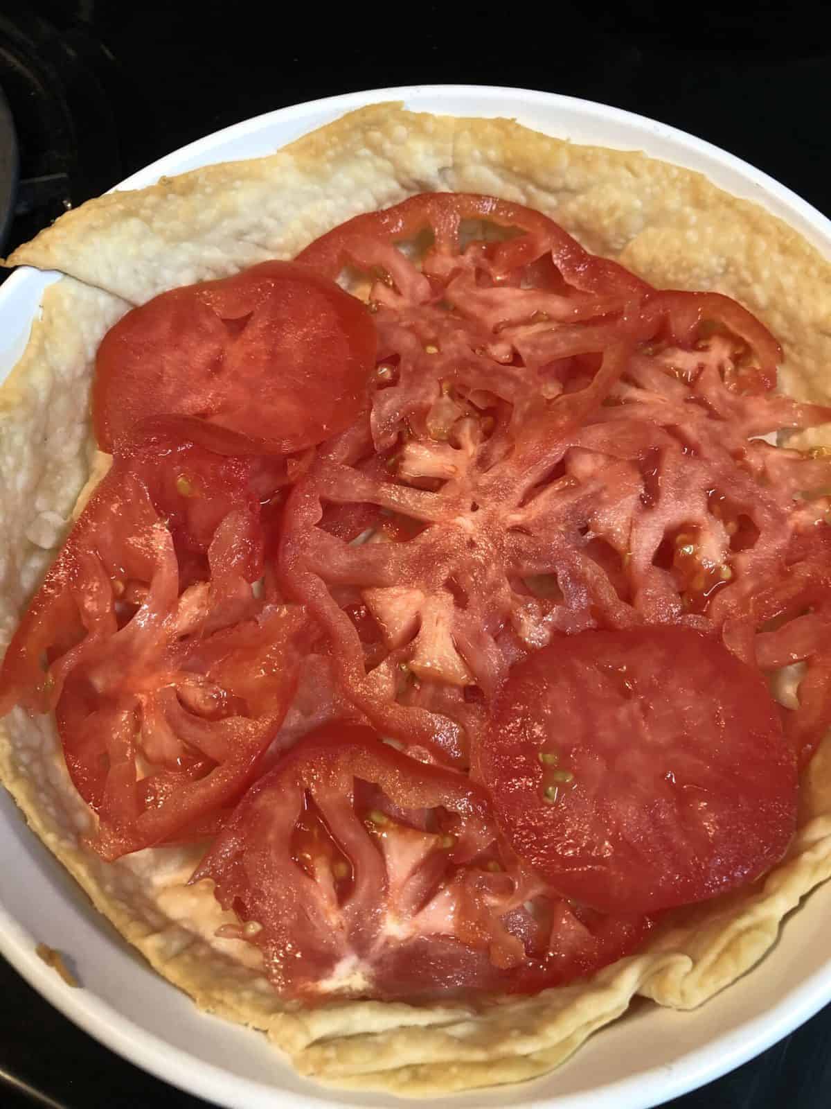 tomatoes layered in baked crust