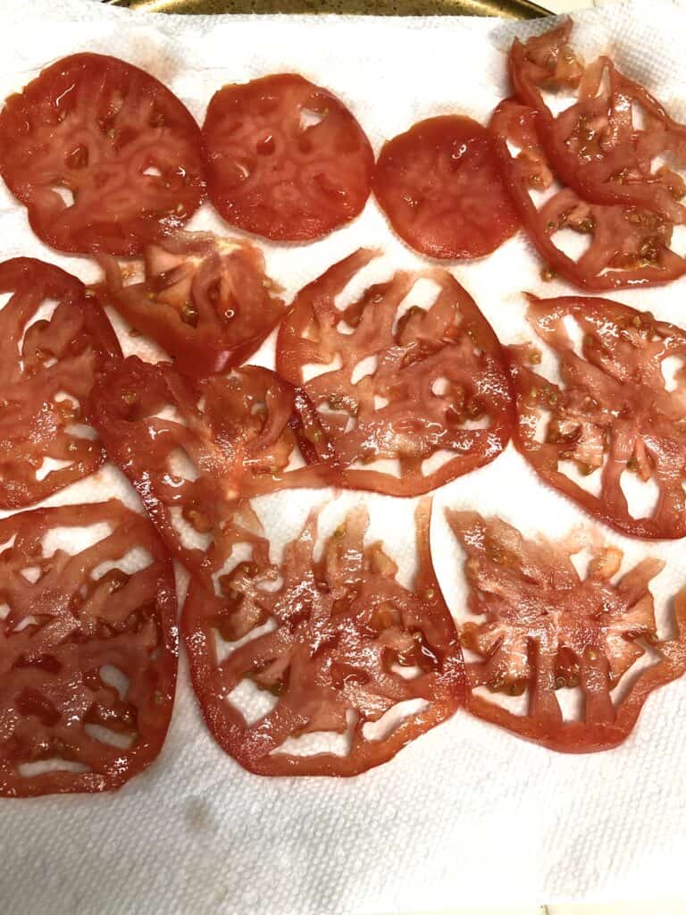 tomatoes draining on paper towel