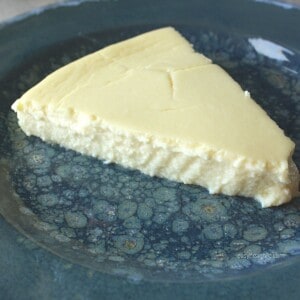 slice of crustless cheesecake on blue plate