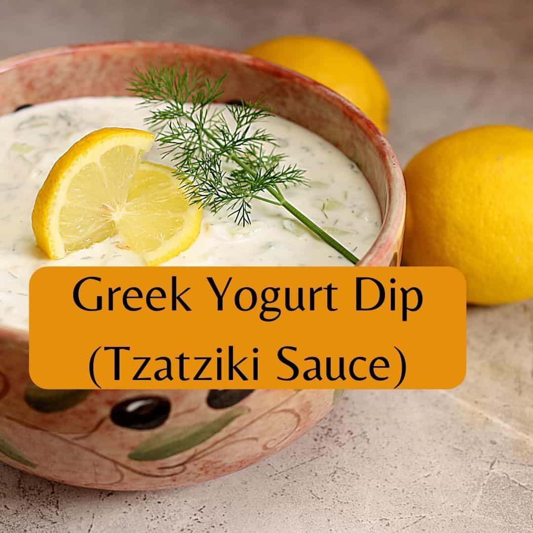 greek yogurt dip in bowl with lemon slice
