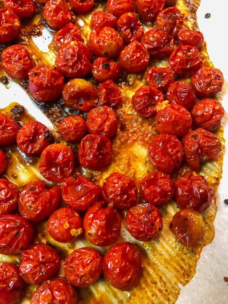 roasted cherry tomatoes on pan