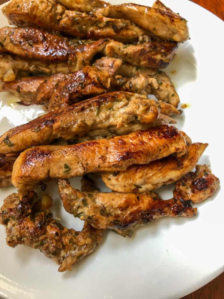 greek chicken tenders on plate