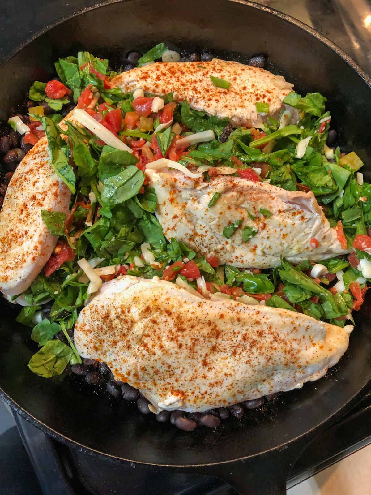 chicken breasts stuffed with spinach in skillet