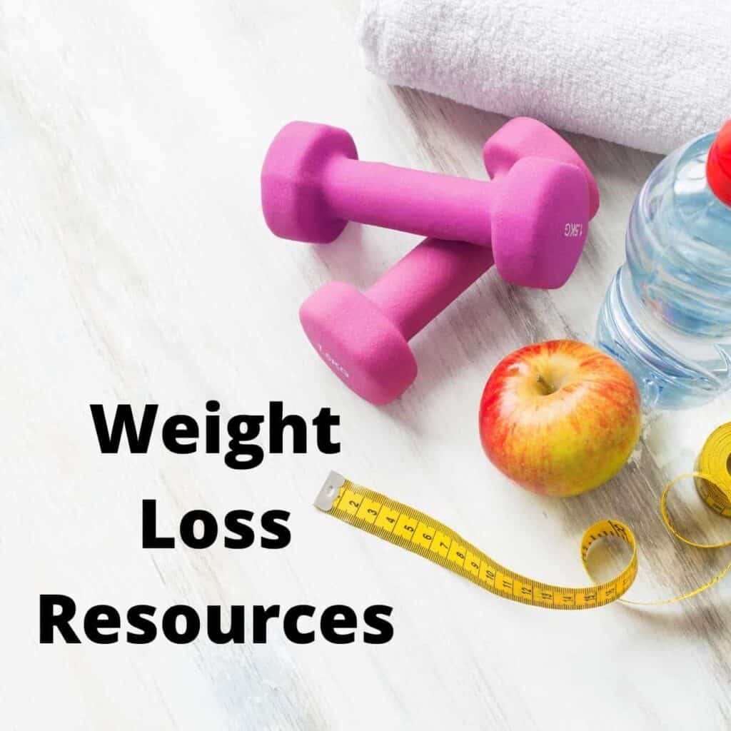 weights, apple, water bottle and tape measure 