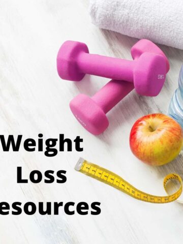 weights, apple, water bottle and tape measure