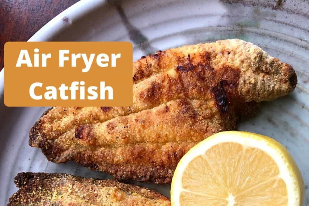 air fryer catfish on plate with lemon half