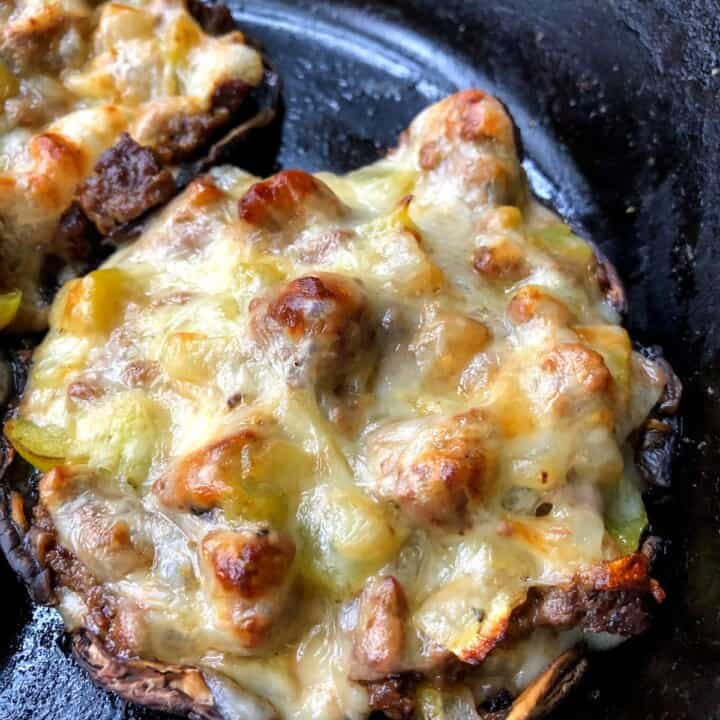 mushroom stuffed with philly cheesesteak with melted cheese on top