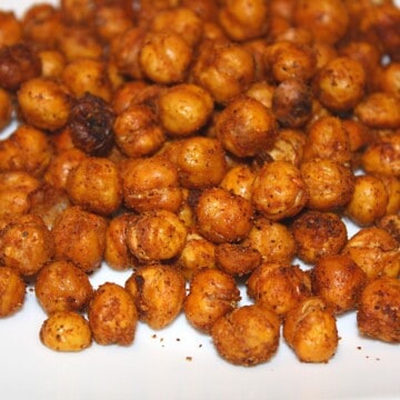 roasted chick peas on white background