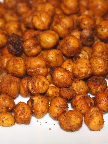 roasted chick peas on white background