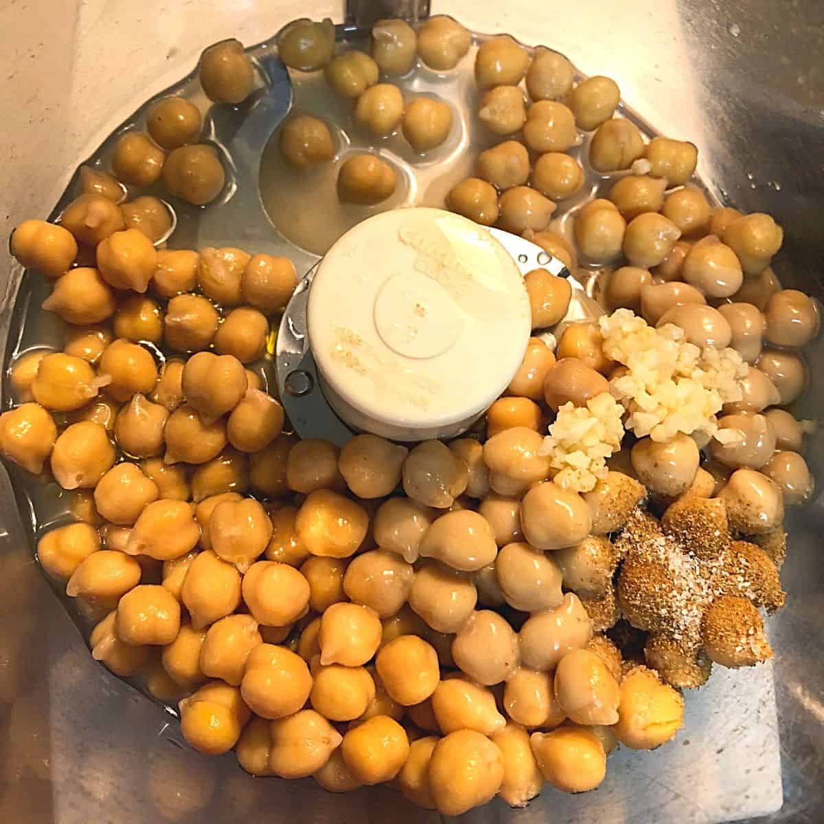 chickpeas and spices in food processor