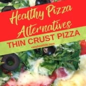 thin crust pizza with chopped spinach and tomatoes