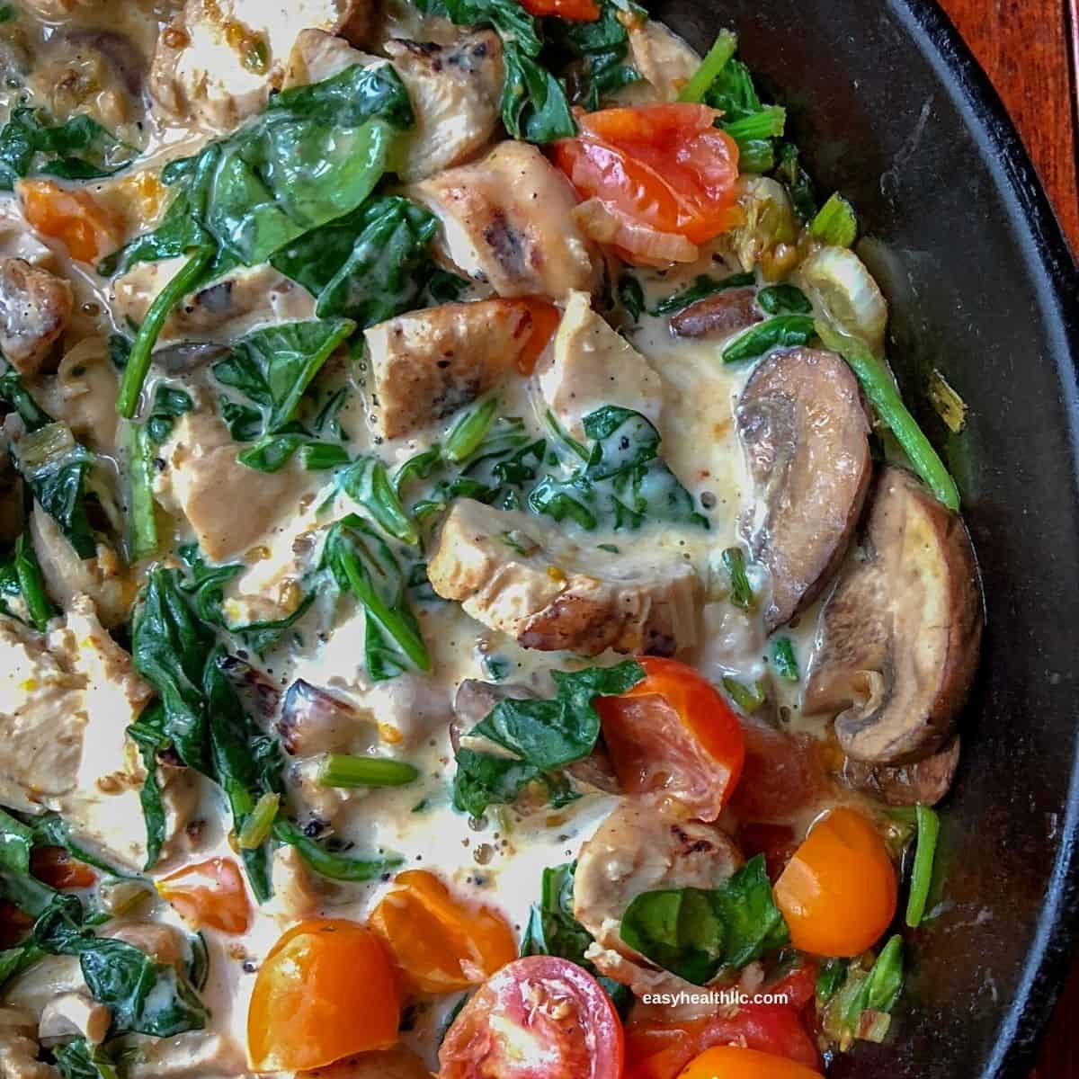 chicken alfredo in black skillet