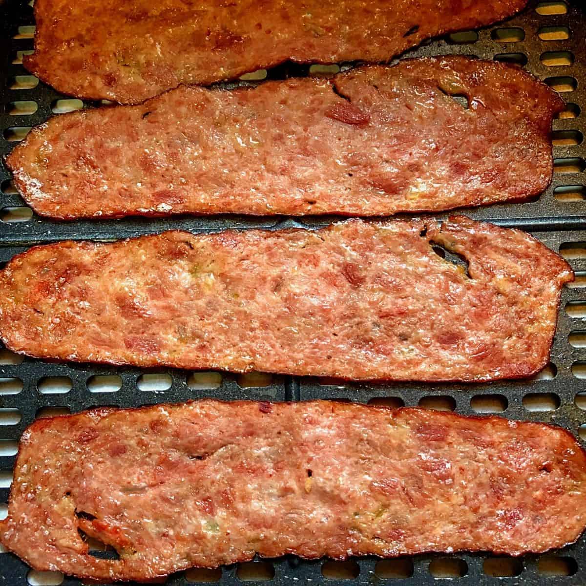 cooked turkey bacon slices in air fryer basket