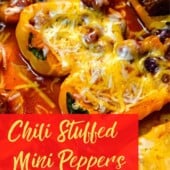 cheese melted on chili stuffed yellow and red mini peppers