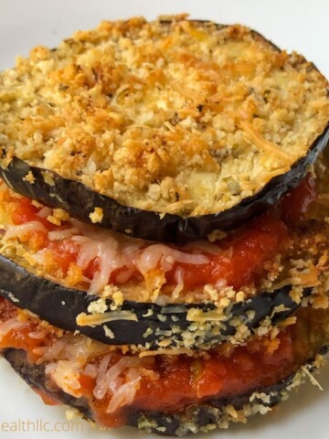 baked eggplant slices layered with tomato sauce