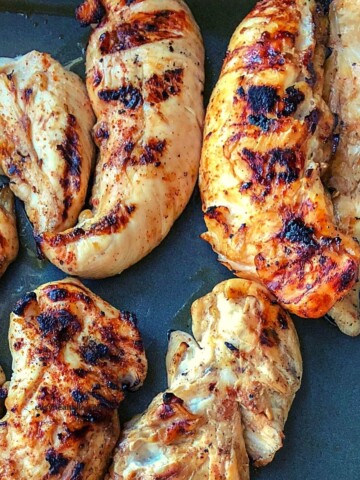 grilled chicken tenders in metal pan