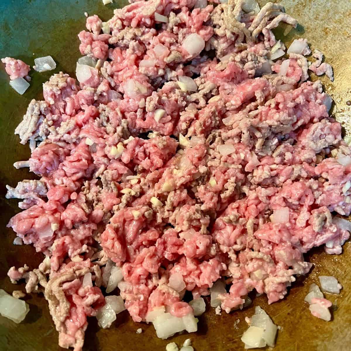 ground pork browning in skillet