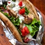 pita stuffed with lettuce, tomatoes and greek chicken