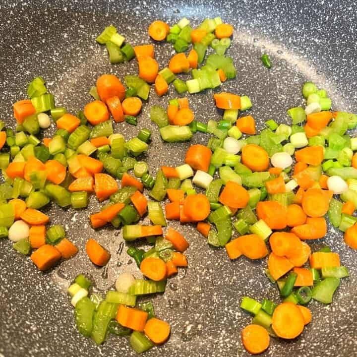 diced veggies sautéing in pan
