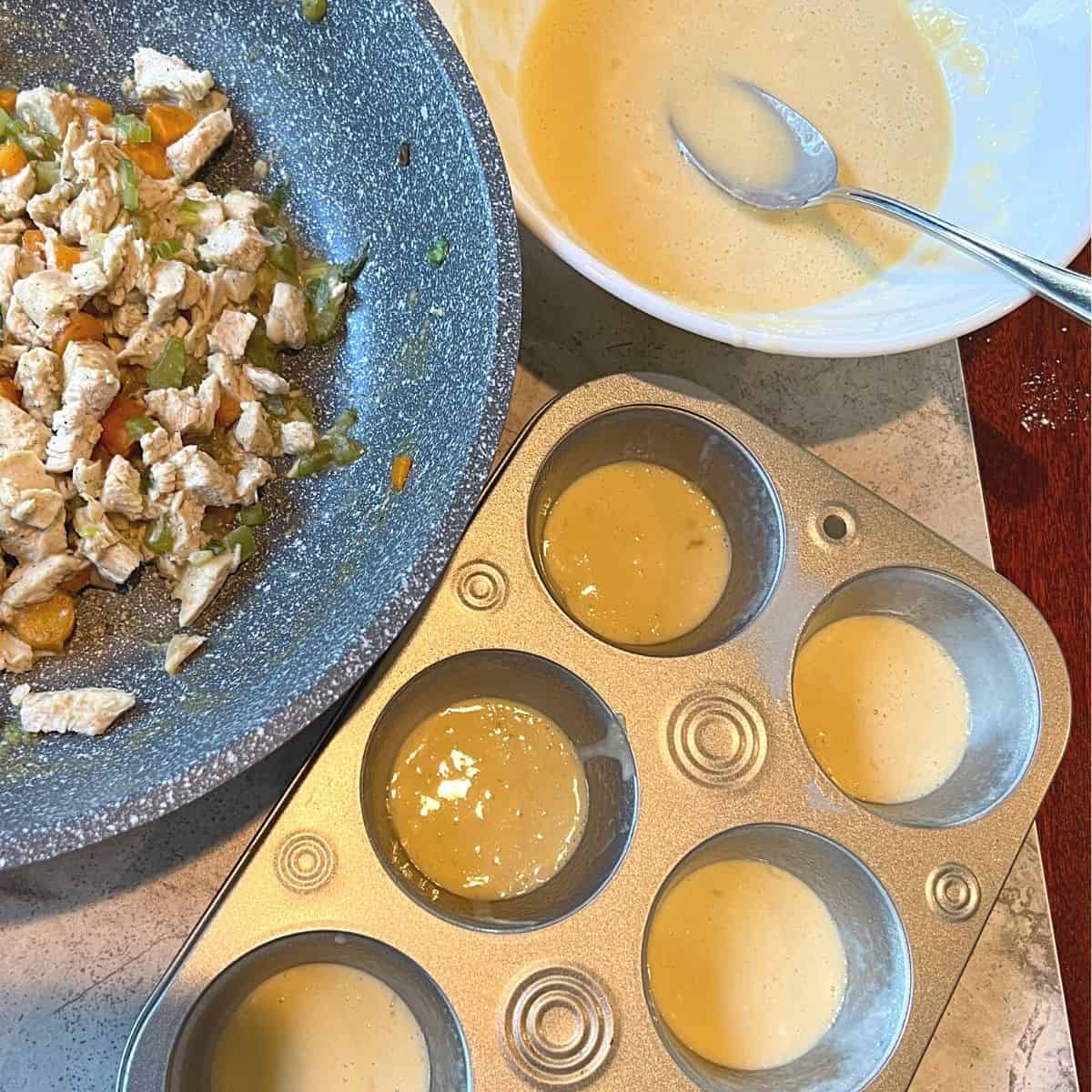 bowl of baking mix, skillet of chicken muffin filling, muffin tin with baking mix in each cup