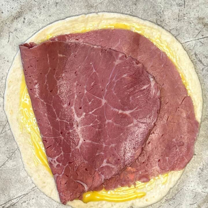 tortilla spread with honey mustard with slice of roast beef