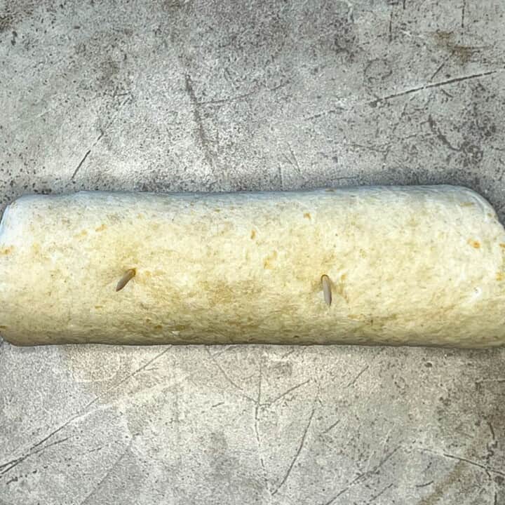 tortilla wrap rolled up and secured with tooth picks